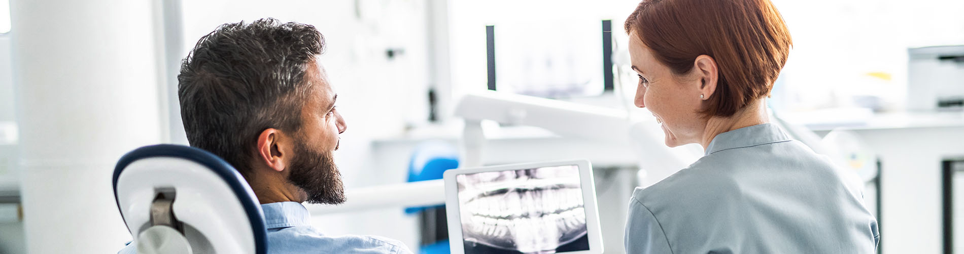 This is a composite image showing medical equipment and supplies, including a stethoscope, blood pressure cuff, tongue depressors, and other instruments, arranged in a manner that suggests they are part of a medical examination or procedure. The background is a solid color to emphasize the items.